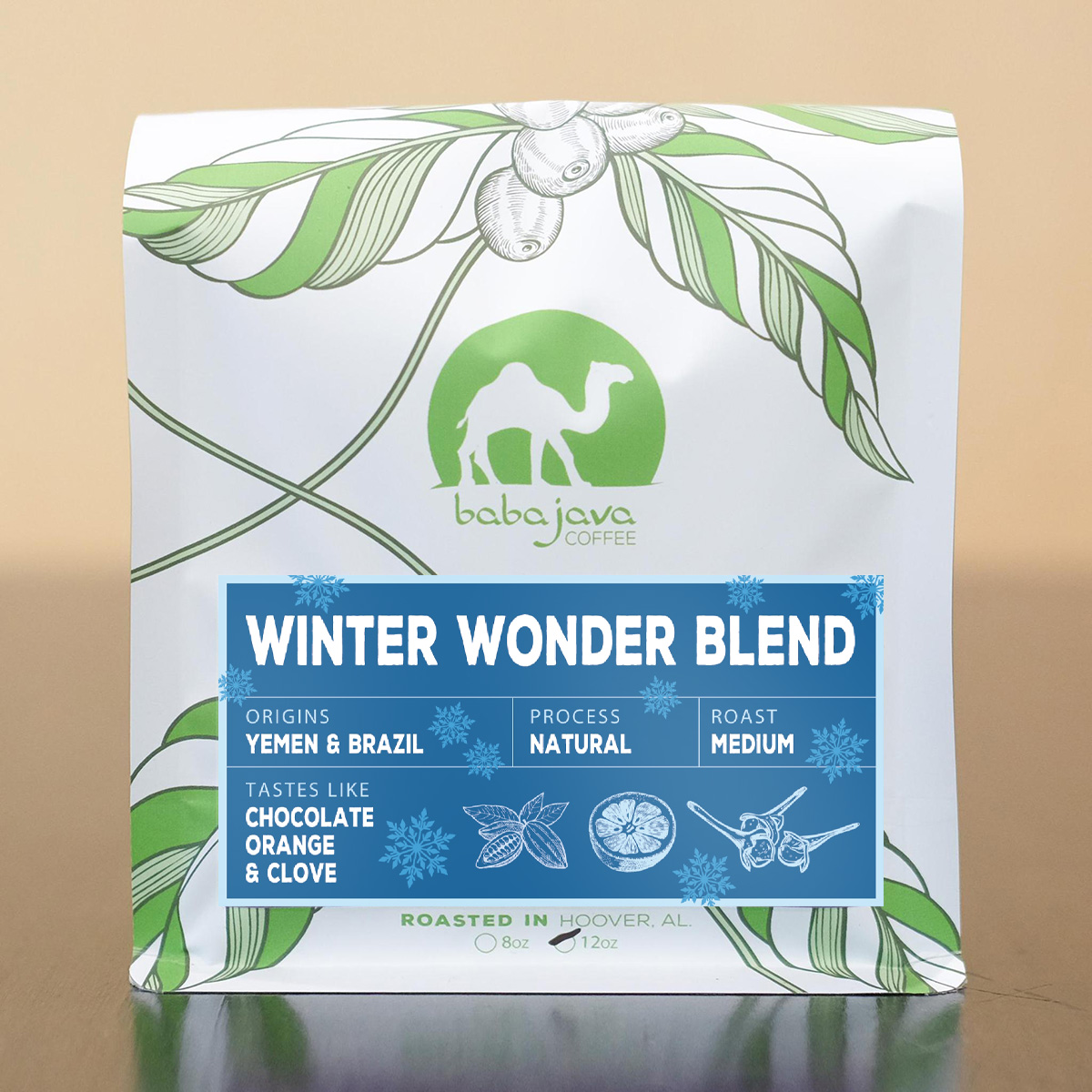 White coffee bag with drawn coffee plant and a blue label that reads Winter Wonderblend